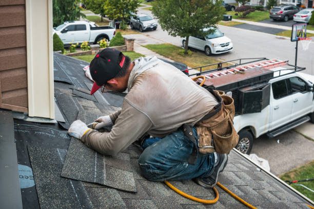 Professional Roofing technician working in Powers, OR